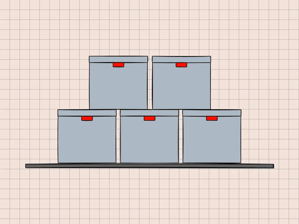 A stack of storage boxes on a shelf.