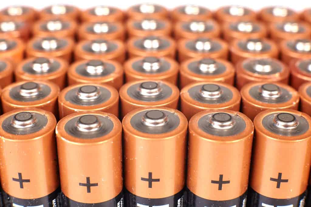 A group of aa batteries on a white background.